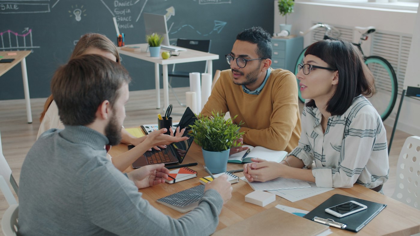 Illustrative photograph of people collaborating, reused from Ziyabo’s existing website